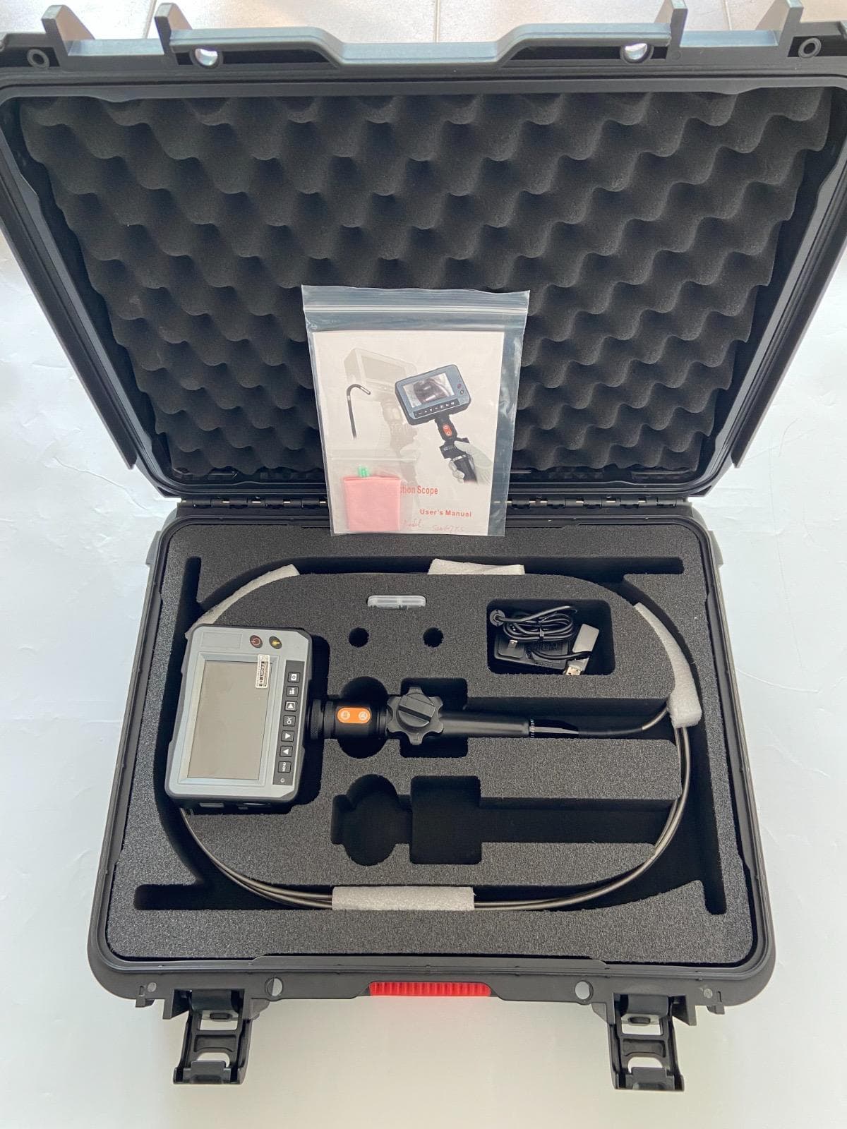 Borescope inspection system arranged in an open protective case